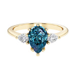 Color changing alexandrite pear shaped 3 stone engagement ring with elegant diamond side stones.