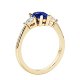 Blue Sapphire three stone pear shaped engagement ring with classic styling.