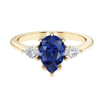 Blue Sapphire pear shaped 3 stone engagement ring with elegant diamond side stones.