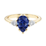Blue Sapphire pear shaped 3 stone engagement ring with elegant diamond side stones.