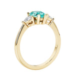 Paraiba Tourmaline three stone pear shaped engagement ring with classic styling.