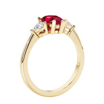 Red Ruby three stone pear shaped engagement ring with classic styling.
