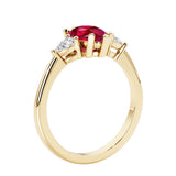 Red Ruby three stone pear shaped engagement ring with classic styling.