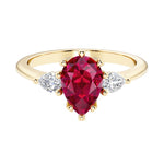 Red Ruby pear shaped 3 stone engagement ring with elegant diamond side stones.