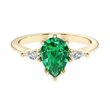 Green Gemstone pear shaped 3 stone engagement ring with elegant diamond side stones.