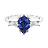 Blue Gemstone 3 stone pear diamond ring set in a delicate band.