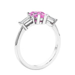 3 stone diamond engagement ring with pear shaped center in white gold featuring Pink Gemstone.