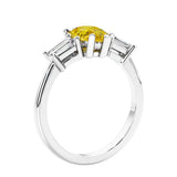 3 stone diamond engagement ring with pear shaped center in white gold featuring Yellow diamond.