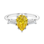 Yellow diamond 3 stone pear diamond ring set in a delicate band.