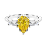 Yellow diamond 3 stone pear diamond ring set in a delicate band.
