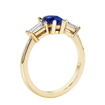 Blue Gemstone three stone pear shaped engagement ring with classic styling.