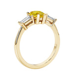 Yellow diamond three stone pear shaped engagement ring with classic styling.