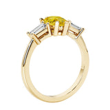 Yellow diamond three stone pear shaped engagement ring with classic styling.