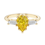 Yellow diamond pear shaped 3 stone engagement ring with elegant diamond side stones.
