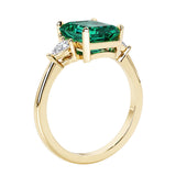Emerald cut 3 diamond ring representing past, present, and future featuring gemstone center.