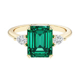 Emerald cut 3 stone engagement ring with gemstone and diamond accents.