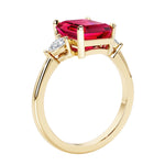 Emerald cut 3 diamond ring representing past, present, and future featuring gemstone center.