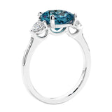 Cushion cut diamond ring as a unique engagement ring featuring three stone design.