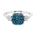 Cushion shaped engagement ring with brilliant diamonds.