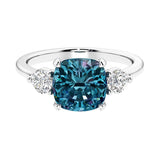 Cushion shaped engagement ring with brilliant diamonds.