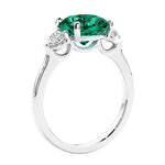 Cushion cut diamond ring as a unique engagement ring featuring three stone design.