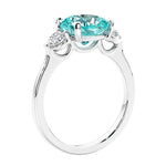 Cushion cut diamond ring as a unique engagement ring featuring three stone design.