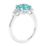 Cushion cut diamond ring as a unique engagement ring featuring three stone design.
