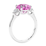 Cushion cut diamond ring as a unique engagement ring featuring three stone design.