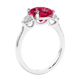 Cushion cut diamond ring as a unique engagement ring featuring three stone design.