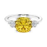 Cushion shaped engagement ring with brilliant diamonds.