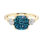 Cushion cut 3 stone engagement ring with soft corners and vintage charm.