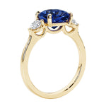 Three stone cushion diamond ring in yellow gold setting.
