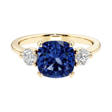 Cushion cut 3 stone engagement ring with soft corners and vintage charm.