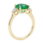 Three stone cushion diamond ring in yellow gold setting.