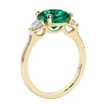Three stone cushion diamond ring in yellow gold setting.