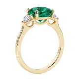 Three stone cushion diamond ring in yellow gold setting.