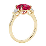Three stone cushion diamond ring in yellow gold setting.