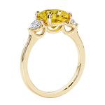 Three stone cushion diamond ring in yellow gold setting.