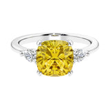 Cushion shaped engagement ring with brilliant diamonds and yellow sapphire.