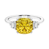 Cushion shaped engagement ring with brilliant diamonds and yellow gemstone.