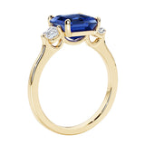 3 stone Asscher cut gemstone diamond ring in a classic Art Deco style.