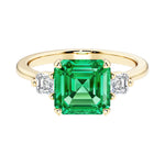 Asscher cut three stone engagement ring with geometric elegance.