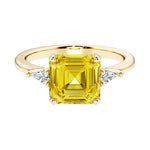 Asscher cut three stone engagement ring with geometric elegance.