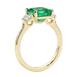 3 stone Asscher cut gemstone diamond ring in a classic Art Deco style featuring a colombian emerald center.