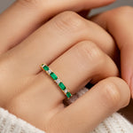 Nine stone anniversary diamond ring for women with vibrant gemstones and white diamonds.