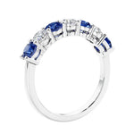 Anniversary diamond ring featuring 7 lab created diamonds and gemstones in a classic band.