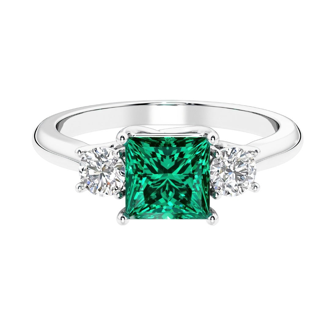 3 stone princess diamond ring in sleek white gold with emerald gemstone.