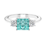 3 stone princess diamond ring in sleek white gold with paraiba tourmaline gemstone.