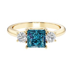 Princess cut 3 stone engagement ring with side diamonds and alexandrite gemstone center.