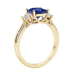 Princess shaped three stone diamond ring in modern style.